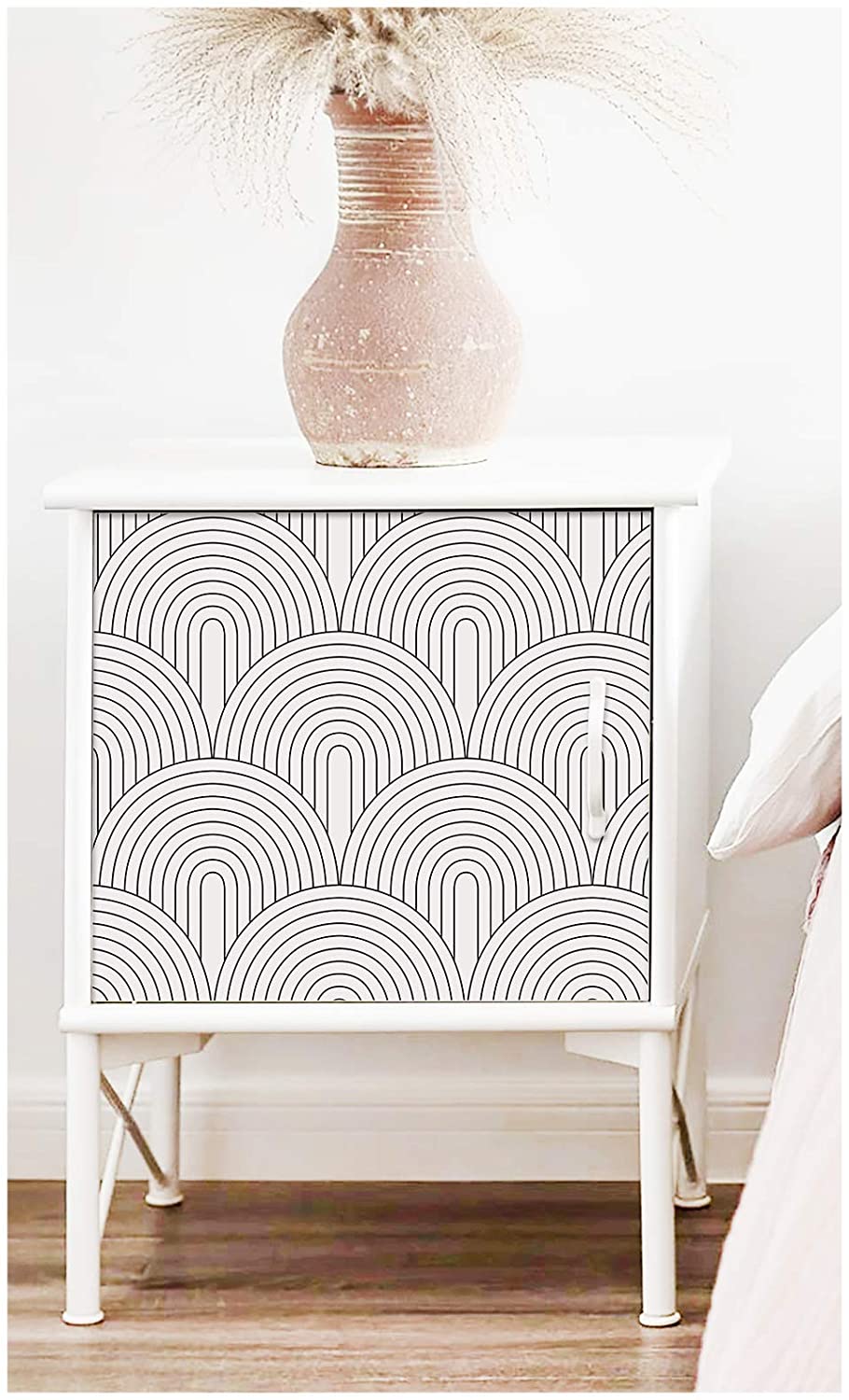 Enhance the look of the nightstand by adding a cute wallpaper to the front
